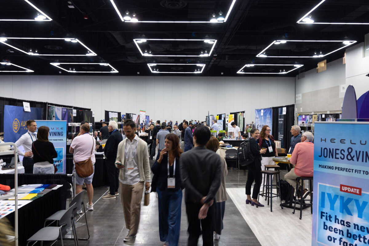 A busy aisle between exhibitor booths in Portland.